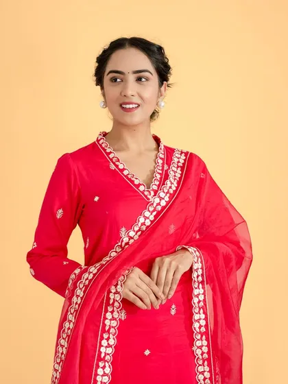 A clean and vibrant studio shot of a model in a bright red ethnic kurta. This image demonstrates our expertise in creating crisp, color-accurate photos for designer lookbooks and e-commerce catalogs.