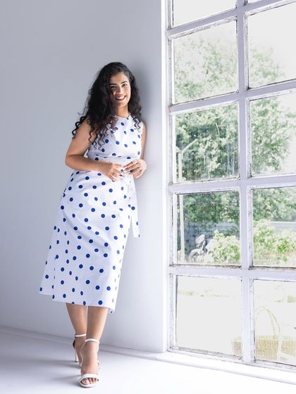 Modeling a classic polka-dot dress for a Fable Street photoshoot. This image showcases a timeless look and highlights my ability to work with clean, studio lighting for e-commerce and campaign imagery.