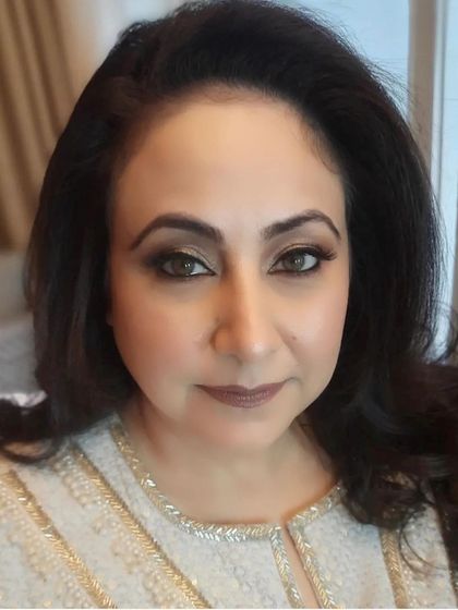 A direct portrait showcasing the final makeup for our client. The look is timeless and graceful, ensuring she looks her best in all the family photographs.