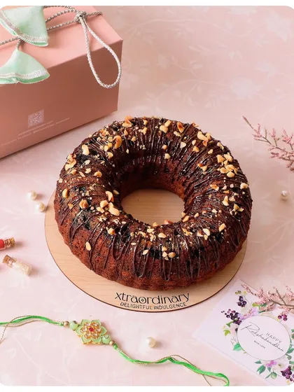 Our Nutella Banana Bundt Cake is a popular choice for Rakhi. It's drizzled with chocolate, topped with nuts, and comes ready for gifting.