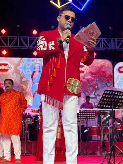 Addressing the audience during Day 2 of Navratri. I use a mix of shayari and high-energy dialogue to keep the crowd hooked.