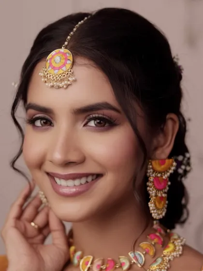 A happy, close-up smile from the 'Khushnuma' look. This shot highlights the flawless, radiant skin and the playful yet elegant makeup, perfect for a joyful Mehendi celebration.