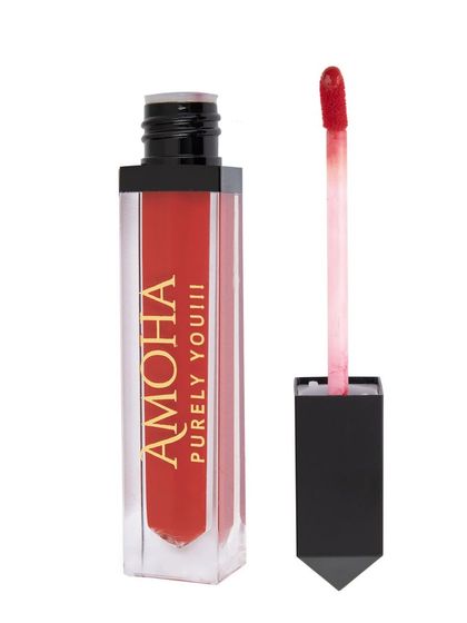 An open tube of red-orange 'Amoha' lipstick on a white background.