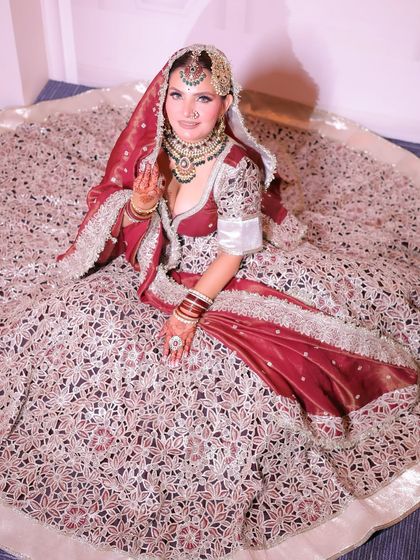A beautiful shot showcasing the entire lehenga. The makeup is balanced to ensure the bride's face remains the focal point.