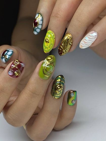 This photo shows the full, breathtaking scope of this fantasy nail art set, with each nail telling its own story through color, texture, and 3D design.