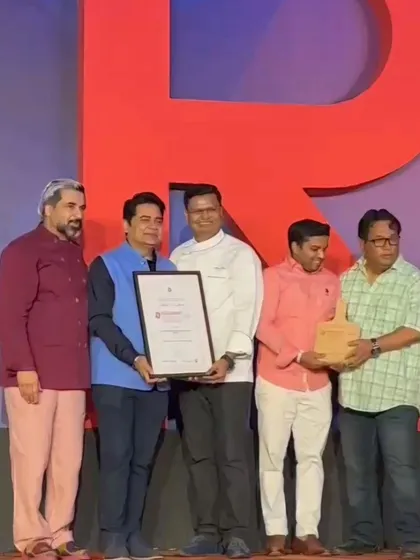 Receiving the award on stage at the Restaurant Awards 2024.