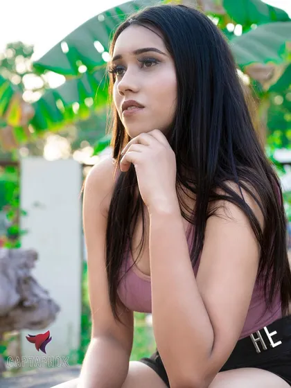 A thoughtful, seated portrait taken outdoors. This image demonstrates my ability to capture quiet, expressive moments on location, adding depth and variety to a model's portfolio or a brand's campaign.
