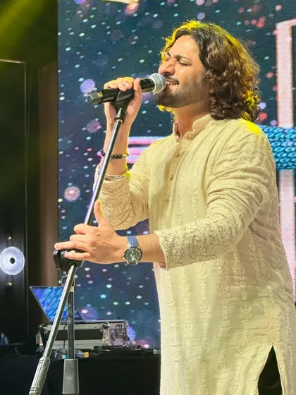 Lost in the melody of 'Saanson Ki Mala Pe' during a live show.