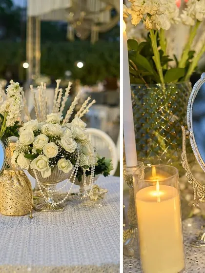 A tablescape with vintage mirrors, pearl strings, and bouquets of white roses. These details are inspired by the dressing tables of Mughal royalty.