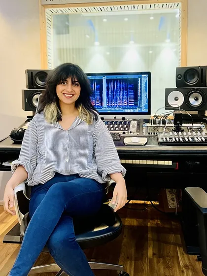 Sukhnidh Kaur looking right at home in our control room. We love providing a comfortable and professional space for artists to work their magic.
