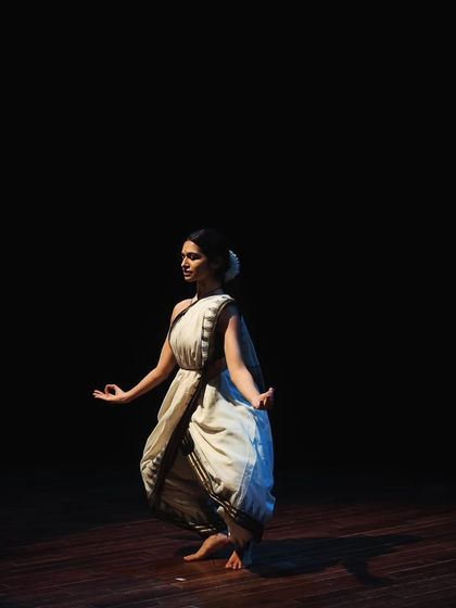 A Bharatanatyam dancer in a graceful pose during the Parabola of Dance event.