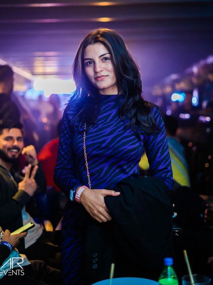 A guest posing at the bar.