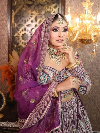 Another angle of the royal purple lehenga, highlighting the jewelry and makeup.