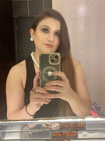 A mirror selfie showing off the full look.