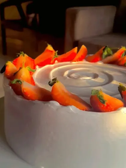 A close-up of the fresh strawberries on my classic strawberry cake, captured in the beautiful golden hour light.