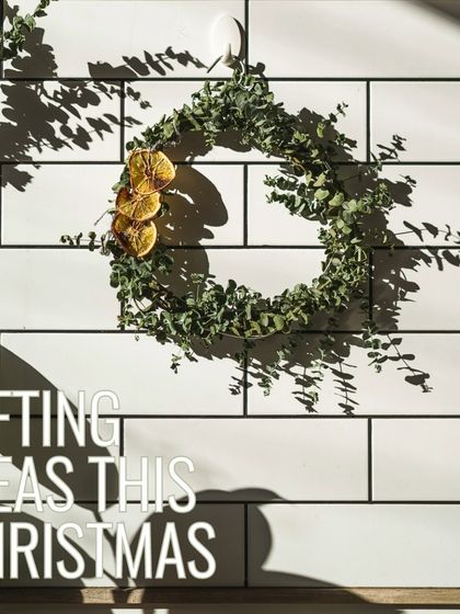 Gifting ideas for the festive season. A handmade wreath hangs on our tiled wall, representing the simple, natural, and beautiful gifts you can find here.