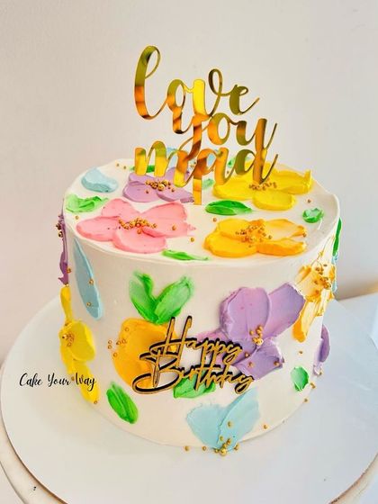 Life’s better when it’s floral and sweet. A cake with painted buttercream flowers for Mom.