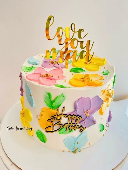 Life’s better when it’s floral and sweet. A cake with painted buttercream flowers for Mom.