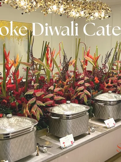 This is an example of my bespoke Diwali catering service. The setup features elegant silver chafing dishes and a stunning tropical flower arrangement, creating a festive and luxurious atmosphere for your celebration.