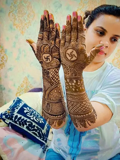 Mehandi is a beautiful part of our traditions. I often incorporate sacred symbols like the Swastika for clients who request it, creating a design that is not only beautiful but also meaningful.