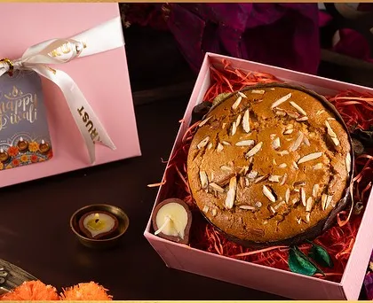 Our Almond Tea Cake beautifully packaged in a pink gift box for Diwali. It's a simple, elegant, and heartwarming gift.