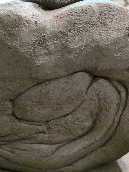 This view shows the dense, smooth consistency of the clay after it has been properly wedged. It's now ready to be transformed on the potter's wheel.