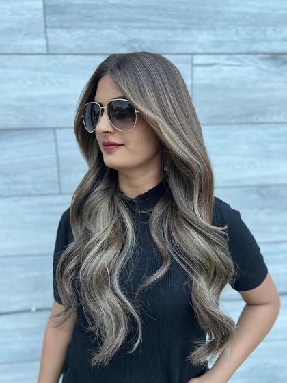 Another angle of the cool-toned summer balayage. This view shows how the ashy blonde highlights are seamlessly blended from the darker roots for a sophisticated and modern look.