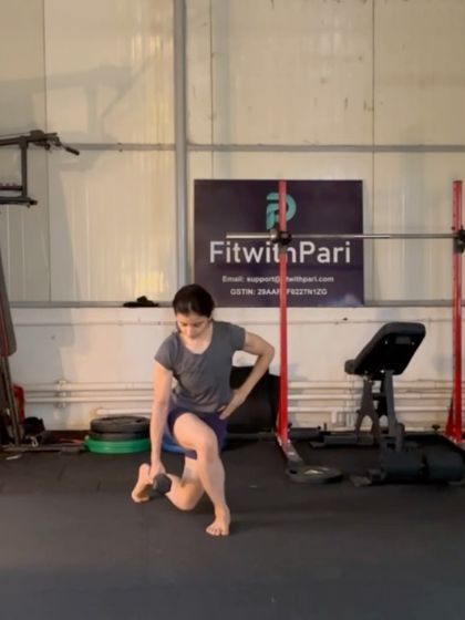 A curtsy lunge with a dumbbell. This exercise targets the glutes and inner thighs from a different angle, adding variety to our leg work.