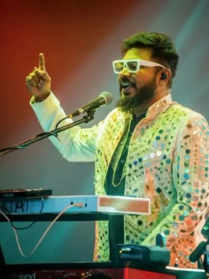 Our keyboardist, pointing to the crowd, sharing a moment of connection.