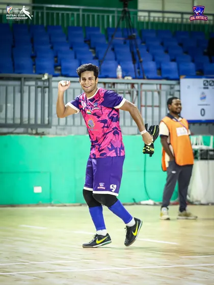 A player celebrating after the semi-final, knowing the job is not done yet.
