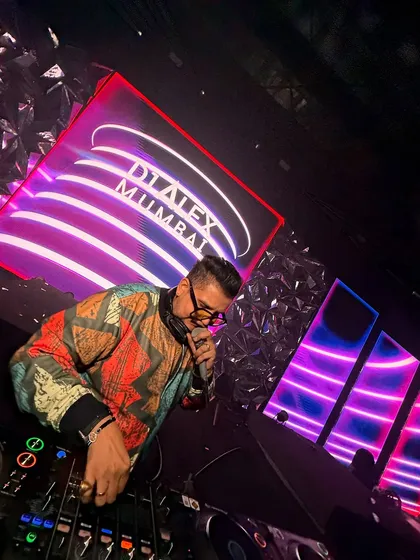 Hyping the crowd on the mic. Interacting with the audience is a key part of my performance style, ensuring everyone feels involved.