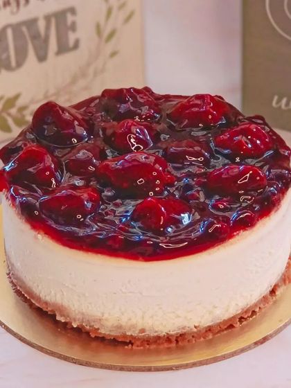 A luscious baked cheesecake topped with a generous layer of sweet and tangy cherry compote.