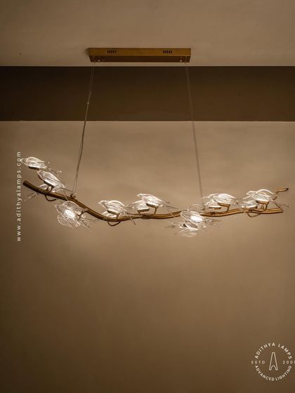 A linear version from our nature-inspired bird series, this hanging fixture is perfect above a long dining table or console. The glass birds seem to flutter along the rose gold branch, adding a touch of delicate artistry.