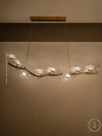 A linear version from our nature-inspired bird series, this hanging fixture is perfect above a long dining table or console. The glass birds seem to flutter along the rose gold branch, adding a touch of delicate artistry.