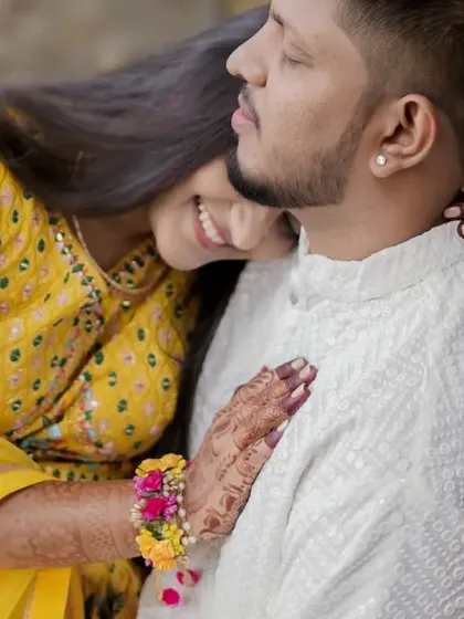 A sweet and tender moment between the couple amidst the Haldi celebrations. Even in the chaos, there are moments of quiet connection.