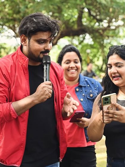 Interacting with participants during a fun outdoor session. I make sure to engage directly with the teams, explaining the rules and encouraging them as they complete the challenges.