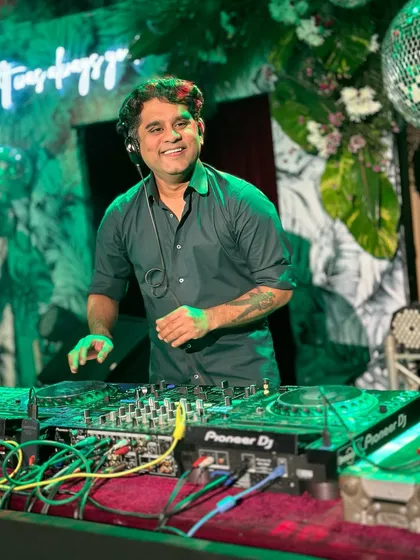 A smile on my face and my hands on the console. This is me in my element, completely focused on the music and the energy of the room. I believe spreading happiness starts with loving what you do.