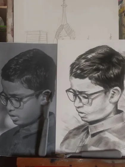 A side-by-side of the reference photo and my charcoal sketch, showing the process of creating realistic art.
