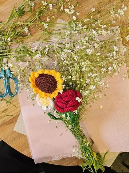I love mixing my crochet flowers with real fillers like baby's breath to create stunning, one-of-a-kind bouquets. This shows the process of creating a custom piece that blends textures.