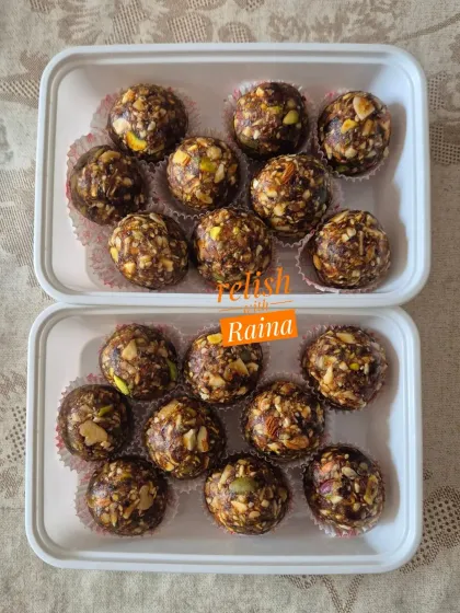 Dryfruit Laddoos packed in convenient containers. They are perfect for snacking on the go.