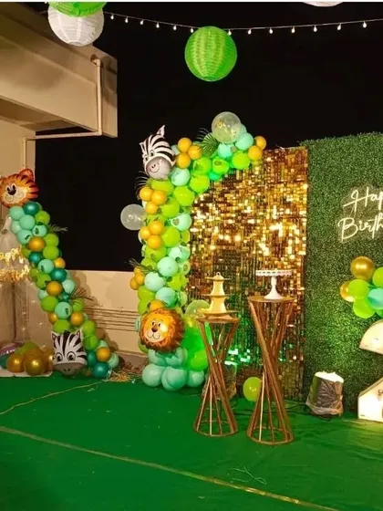 A wide view of the terrace safari setup, showing how all the elements come together, including a small tent for the kids and hanging lanterns that create a festive evening ambiance.