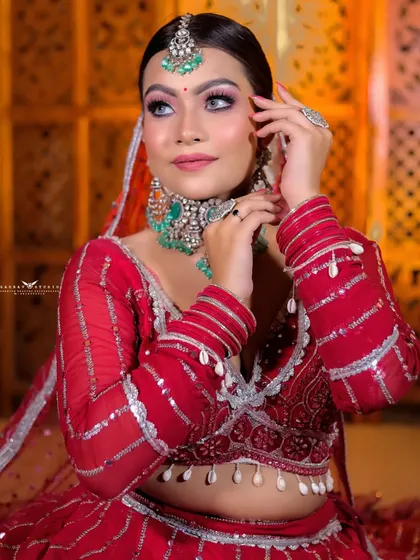 A beautiful portrait capturing the bride's gentle expression and the details of her turquoise and silver jewelry.
