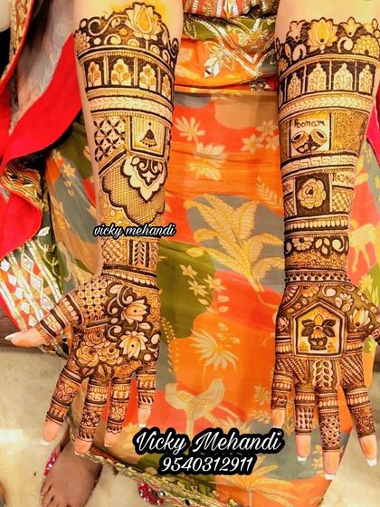 A beautiful, intricate design with a mix of floral, geometric, and traditional house motifs.