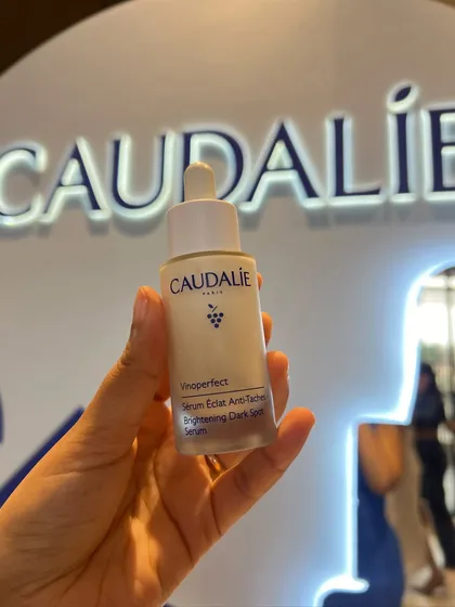 A close-up of the iconic Caudalie Vinoperfect Serum. This product is a staple in my routine for tackling dark spots and brightening my complexion.