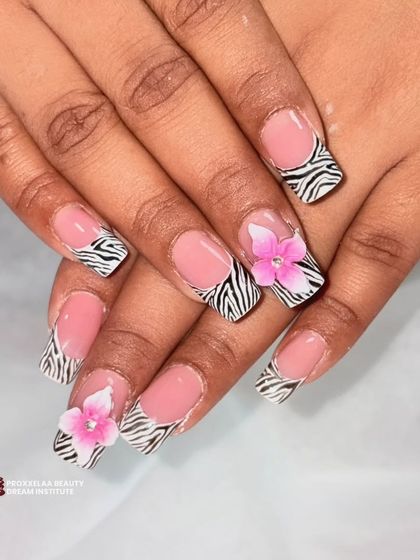 Another angle of the zebra and floral nail art, showing how different elements can be combined for a stunning and personalized design.
