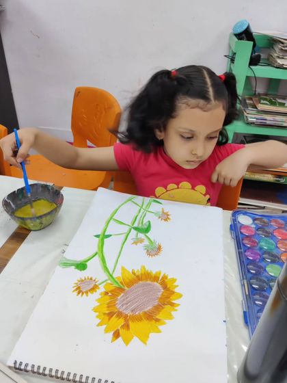 More images of our dedicated young artists at work and proudly displaying their creations.