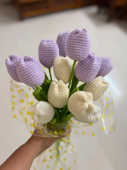 Another angle of the lavender and cream tulip bouquet, showing the full shape and the careful arrangement of the flowers.