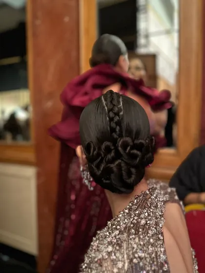 The Medusa-inspired hair look I designed for a Gaurav Gupta show. This avant-garde style features intricate braids and loops to create a structural and artistic statement on the runway.