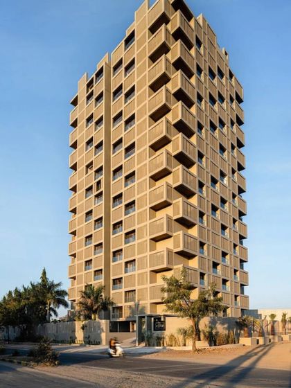 The full elevation of the 'SCREEN 504' apartment building, showing its impressive scale and rhythmic facade. This project is a landmark example of climate-responsive architecture in Rajasthan.