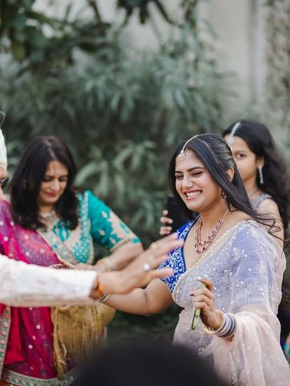 The bride's family dancing with joy during the baraat procession.